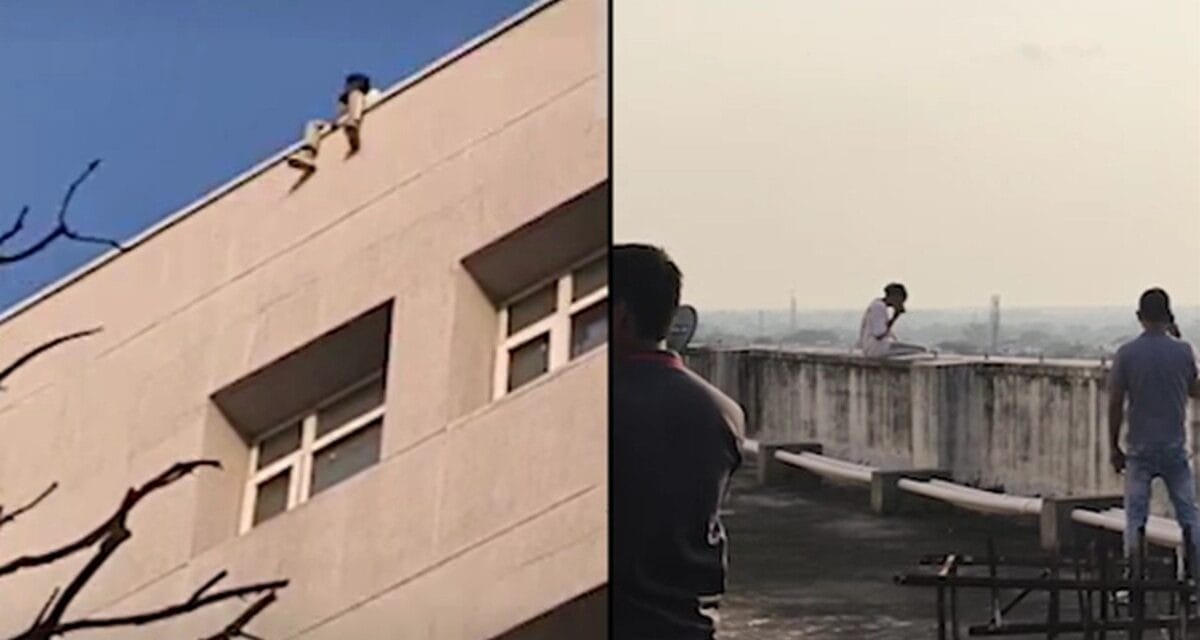 बिल्डिंग से पांव लटकाए कूदने को तैयार…फोन पर रोती हुई लड़की …ऐसे बची जान, VIDEO